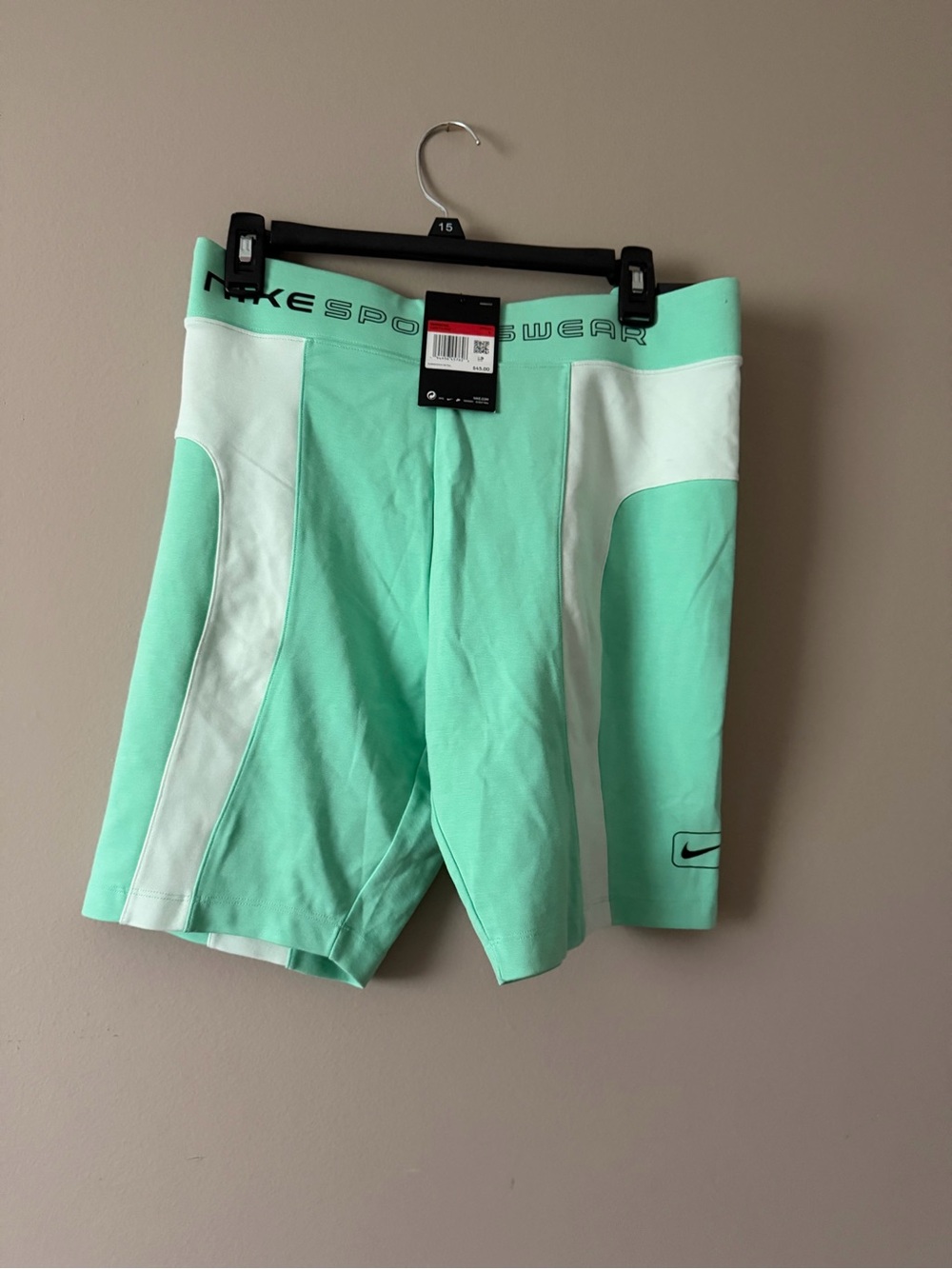 Nike Women's Mint Green Athletic Shorts with White Swoosh